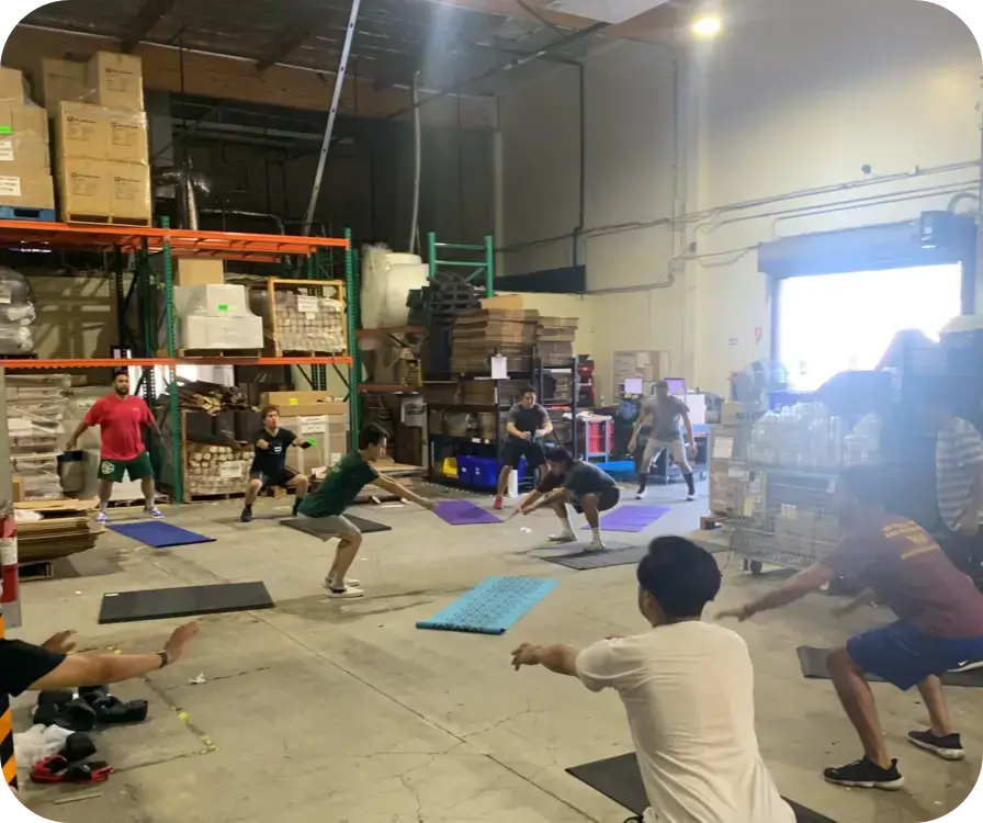 Warehouse employees team building workouts